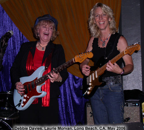 Debbie Davies and Laurie Morvan playing on stage in Long Beach, CA.